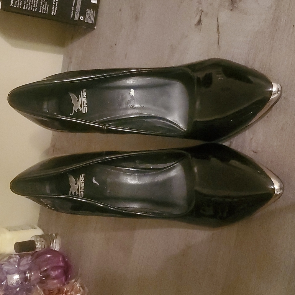 Size 8, black patent leather, gold tip heels